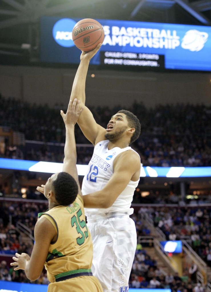 FILE - In this March 28, 2015, file photo, Kentucky's Karl-Anthony Towns (12) shoots over Notre Dame's Bonzie Colson (35) in the first half of a college basketball game in the NCAA men's tournament regional finals in Cleveland. Towns seems the likely pick by the Minnesota Timberwolves at No. 1 in the NBA draft on Thursday, June 25, 2015. (AP Photo/David Richard. File)