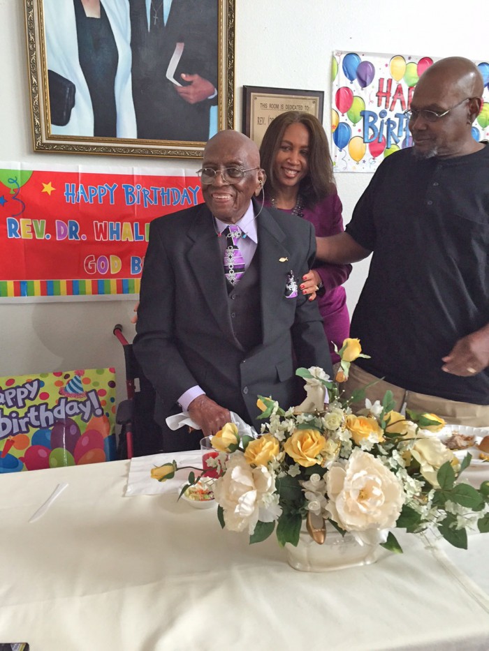 Dr. Whalen Jones enjoys his 106th birthday party with his children, Marlene and David.  (photo by Cora J. Fossett)