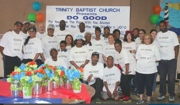 Pastor Alvin Tunstill (back row, center) and the volunteers prepare to serve others. 