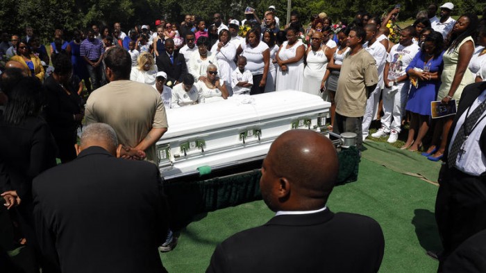 Mourners mourn the death of Sandra Bland at the Mt. Glenwood Memorial Gardens West cemetery Saturday, July 25, 2015, in Willow Springs, Ill. (AP Photo)