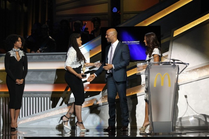 Pictured, Academy award-nominated filmmaker, Ava DuVernay accepts award from actor/rapper, Common alongside actress, Salli Richardson Whitfield at the 12th annual 365Black Awards. (Courtesy Photo)