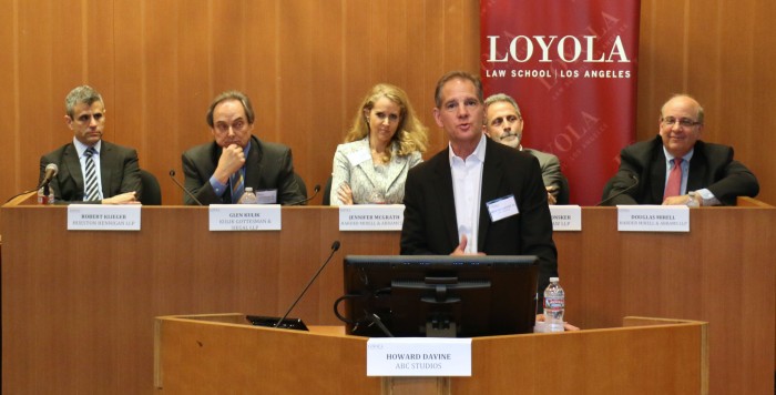 Keynote speaker and executive vice president at ABC Studios Howard Davine and first set of panelist Robert Klieger, Glen Kulik, Jennifer McGrath, Michael Plonsker and Douglas Mirell speaking at the Loyola Law School Hot Topics Symposium. (Photo by Loyola Law School) 