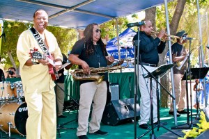 The legendary Charles Wright (Front) and the 103rd Street Rhythm Band performs their classic, “Express Yourself,” to a standing room only audience at the 49th annual Watts Summer Festival stage at Ted Watkins Park. 