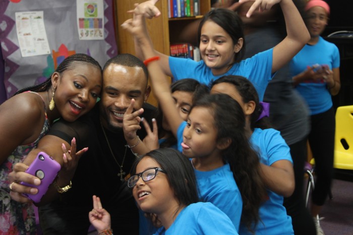 Finnie and Naughton take pictures with the girls after giving them words of encouragement about the entertainment industry. (Antonio de Graffenreaidt/Saving Our Daughters) 