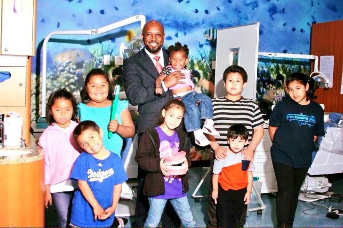  Compton Unified School District Board President Micah Ali poses with Today’s Fresh Start Charter School students. (courtesy photo) 