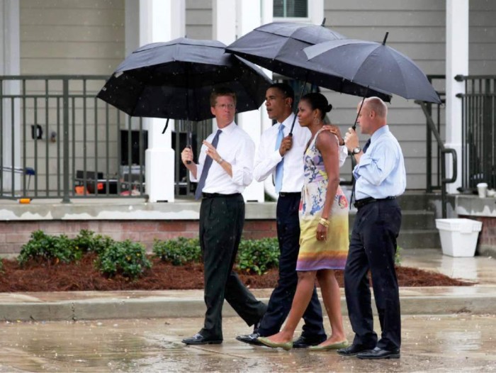 In this photo taken Aug. 29, 2010, President Barack Obama, first lady Michelle Obama, then-Housing and Urban Development Secretary Shaun Donovan, left, and New Orleans Mayor Mitch Landrieu, right, tour Columbia Parc Development in New Orleans on the fifth anniversary of Hurricane Katrina. President Barack Obama will visit New Orleans next week to mark the approaching 10th anniversary of Hurricane Katrina. (AP Photo/Carolyn Kaster)