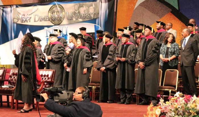 Gospel recording artitst Fred Hammond (3rd from left) joins graduates and honorees during the NDU commencement ceremony on August 15. (photo by Brittany K. Jackson)