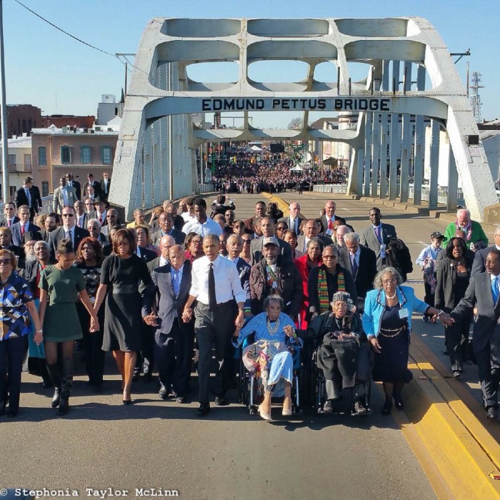 Boynton, in wheelchair next to President Obama, at 50th anniversary celebration of the Selma to Montgomery March (Photo by Stephonia Taylor McLinn).