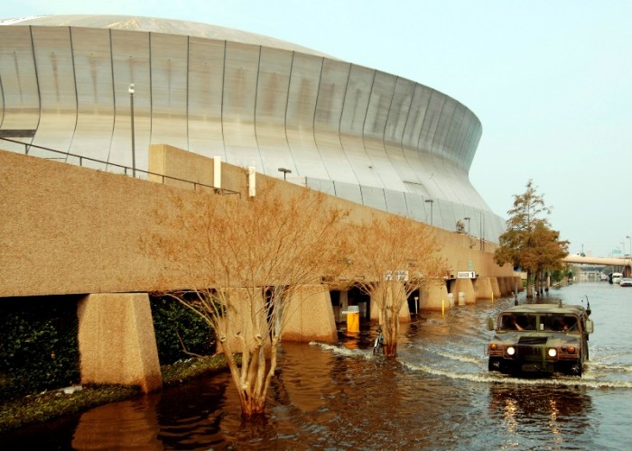 A National Guard Humvee departs the New Orleans Superdome to patrol the streets after Hurricane Katrina devastated the city leaving thousands stranded. (U.S. Navy photo)