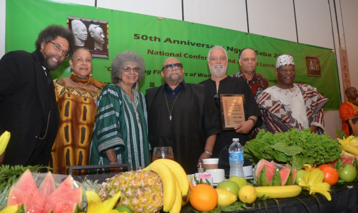 Nguzo Saba 2015 Awards Luncheon. Standing from left to right: Dr. Cornel West, Dr. Freya Rivers, Mrs. Tiamoyo Karenga, Dr. Maulana Karenga, Mr. Danny Bakewell, Dr. Haki Madhubuti, Dr. Molefi Asante, and Mr. Tulivu Jadi.