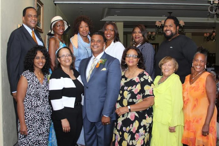 Pastor James K. McKnight (3rd from left) gathers with members of the anniversary committee. From left (1st row) are Kameron Burwell, chair; Stani Baker, Carol Hall Holliday, Marcia Gleason, Ellen Love, (2nd row) G. Bernard Brown, Donna Brooks, Virginia P. Bland, Sherri McGee McCovey, Susan Comrie and Ashley Faatoalia.