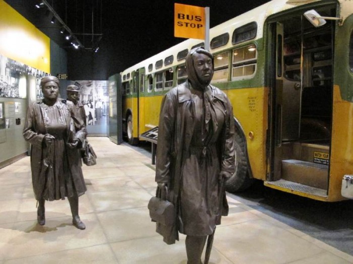 Statues of three women walking next to a replica of a city bus are part of an exhibit about Montgomery's bus boycotts at the newly-renovated National Civil Rights Museum in Memphis. Organizations across the United States are now planning for the 60th anniversary of the massive boycott that changed the course of Civil Rights history in the country. (Photo by Associated Press /Times Free Press.)