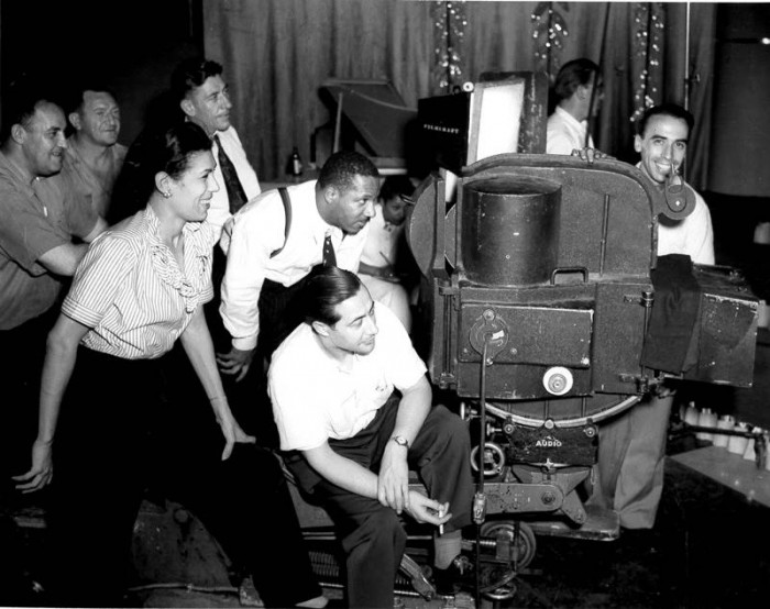 Filmmaker William Alexander (top-center) on set with crew, Filmcraft Studios, Bronx, NY, c.1946. (Collection of the California African American Museum)