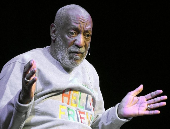 In this Friday, Nov. 21, 2014, file photo, comedian Bill Cosby performs at the Maxwell C. King Center for the Performing Arts, in Melbourne, Fla. On Monday, Dec. 14, 2015, Cosby filed counterclaims in federal court in Springfield, Mass., against seven women who are suing him for defamation, accusing them of making false accusations of sexual misconduct for financial gain. That same day, Boston University trustees voted to revoke an honorary degree awarded to Cosby during its May 2014 commencement. (AP Photo/Phelan M. Ebenhack, File)