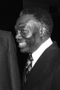 In this Saturday, March 10, 1979 file photo, President of Fisk University Walter Leonard congratulates John Hope Franklin of the University of Chicago during a ceremony in Chicago. Leonard, a man who designed an admissions process at Harvard University that led to more minority students being admitted, died at 86 of complications from Alzheimer's disease earlier in December 2015, his wife Betty Leonard said. (AP Photo)