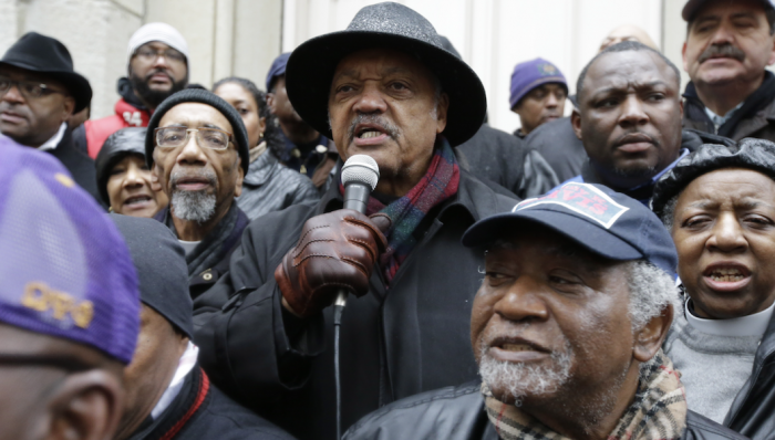 2-The Rev. Jesse Jackson speaks to demonstrators on Friday, Nov. 27, 2015, in Chicago, as community activists and labor leaders hold a demonstration billed as a "march for justice" in the wake of the release of video showing an officer fatally shooting Laquan McDonald. (AP Photo/Nam Y. Huh)