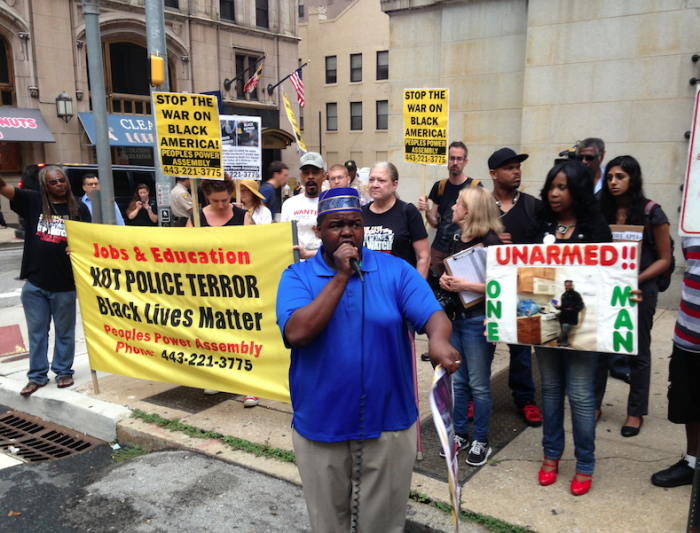 The Rev. C.D. Witherspoon, president of the Baltimore chapter of the Southern Christian Leadership Conference, speaks during a protest on Thursday, Sept. 10, 2015, at the Baltimore courthouse. (AP Photo/Brian Witte)