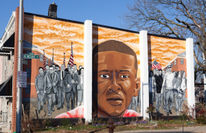 A Freddie Gray memorial mural seen on the side of a house across the street from where he was arrested. | Photo by Cheriss May, Howard University News Service.