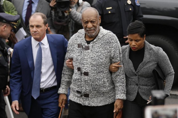 In this Wednesday, Dec. 30, 2015 photo Bill Cosby, center, accompanied by his attorneys Brian McMonagle, left, and Monique Pressley, arrives at court to face a felony charge of aggravated indecent assault, in Elkins Park, Pa. The attorneys hired to defend Cosby in the sex-assault case are a study in contrasts. McMonagle, 57, is expected to lead the defense arguments inside the courtroom when Cosby, 78, returns to court Feb. 2 in a crucial bid to have the case dismissed. (AP Photo/Matt Rourke)