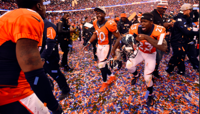 Broncos Safety Josh Bush (20) and Running Back Ronnie Hillan Savor the Moment.  Photo:  John Leyba