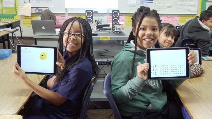 Jefferson Elementary School fourth-graders Ryann Williams and Shamiya Comer show off their new iPads, Friday, January 15. “You can do so many things with an iPad,” said Comer. Courtesy Photo