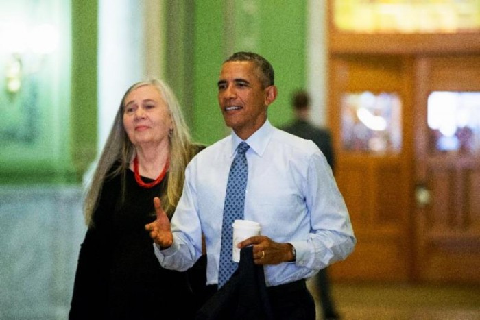 In this Sept. 14, 2015, file photo, President Barack Obama, accompanied by Pulitzer Prize-winning Iowa writer Marilynne Robinson, arrives at the State Library of Iowa in Des Moines. Robinson tossed out phrases like “religious humanism” and “the sinister other.” The interviewer asked her about her upbringing and writing process. At an hour and 7,000 thoughtful words, the discussion sounded like a college seminar or an independent bookstore reading. But this was part of the White House’s new media strategy. (AP Photo/Andrew Harnik, File)