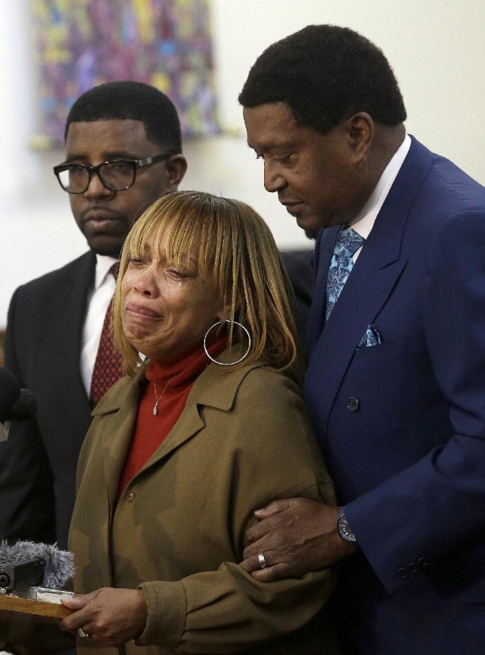 Attorney John Burris, right, comforts Gwendolyn Woods, the mother of Mario Woods, the man killed by San Francisco police after they say he appeared to raise an 8-inch knife and approach an officer, as she speaks at a news conference in San Francisco, Monday, Jan. 18, 2016. The family has asked the U.S. Department of Justice to investigate the officers who shot Woods on Dec. 2, 2015, and review the department's use of deadly force, stops, and detention and searches of African American and Latino citizens for possible civil rights violations. (AP Photo/Jeff Chiu)