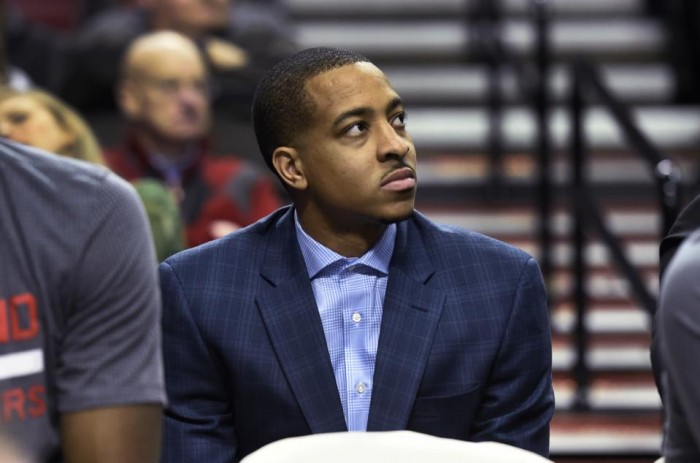 Portland Trail Blazers guard C.J. McCollum sits on the bench during the second half of an NBA basketball game against the Los Angeles Clippers in Portland, Ore., Wednesday, Jan. 6, 2016. McCollum was inadvertently left off the roster and did not play in the game. The Clippers won 109-98. (AP Photo/Steve Dykes)