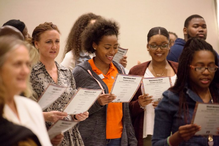 Cal State Fullerton Black History Month reception attendees sing the National Anthem Courtesy Photo