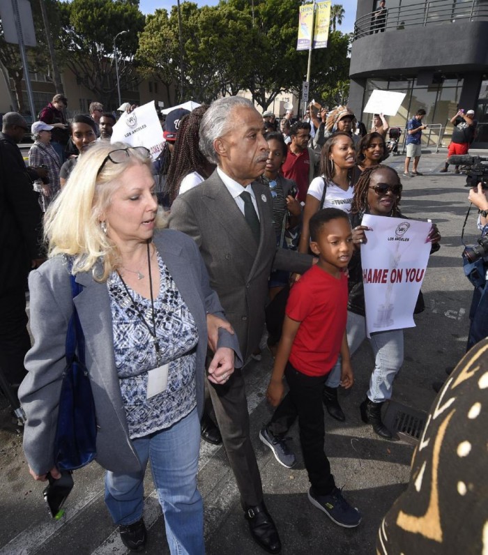 Rev. Al Sharpton, center, leads a rally prior to the Academy Awards ceremony, Sunday, Feb. 28, 2016, in the Hollywood section of Los Angeles in support of the nationwide tv tune-out protesting the lack of diversity in Hollywood. (AP Photo/Mark J. Terrill)