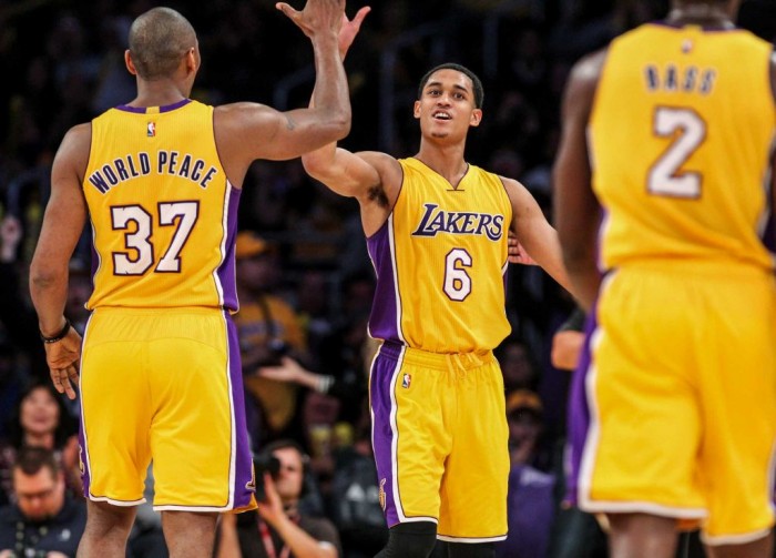 Los Angeles Lakers forward Metta World Peace, left, celebrates with Jordan Clarkson, center, during a timeout in the second half of an NBA basketball game against the Orlando Magic Tuesday, March 8, 2016, in Los Angeles. The Lakers won 107-98. (Ringo H.W. Chiu, AP)