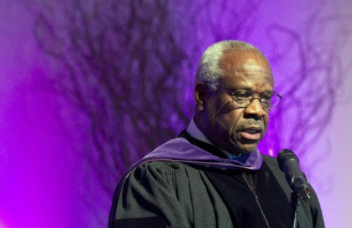  In this Jan. 26, 2012 file photo, Supreme Court Justice Clarence Thomas speaks at College of the Holy Cross in Worcester, Mass. Thomas has asked questions during Supreme Court arguments for the first time in 10 years. (AP Photo/Michael Dwyer, File)