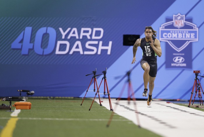 Notre Dame receiver Will Fuller runs the 40-yard dash at the NFL football scouting combine in Saturday, Feb. 27, 2016, in Indianapolis. (AP Photo/Darron Cummings)