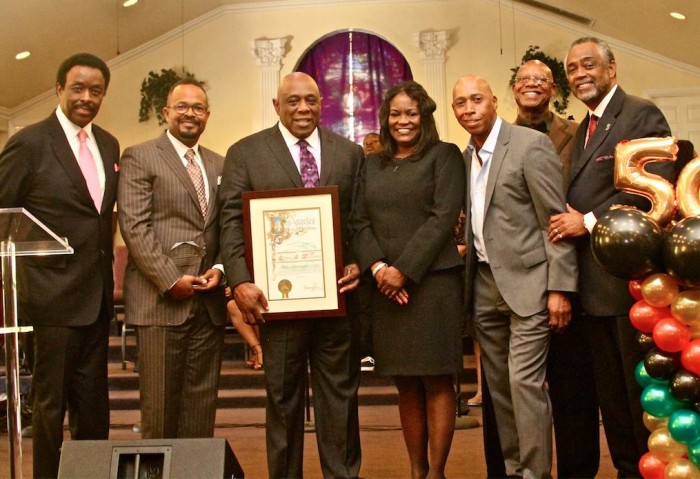 From left are sportscaster Jim Hill, Rodney Phillips of Woody’s Barbeque, Pastor R.A. Williams, Michelle King, Jeffrey Osborn, James Smith and L.A. Councilman Curren Price. (photo by E. Mesiyah McGinnis)