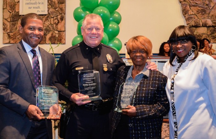 (L to R), LAPD Deputy Chief William "Bill" Scott, LAPD Commander Phillip Tingirides, Watts Gang Task Force President Betty Day, and Pastor Sonja R. Dawson. 