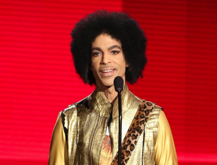 In this Nov. 22, 2015 file photo, Prince presents the award for favorite album - soul/R&B at the American Music Awards in Los Angeles. (Photo by Matt Sayles/Invision/AP, File)