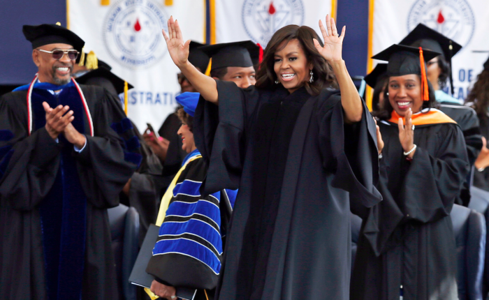 First lady Michelle Obama waves at the graduating seniors as she walks to her seat prior to delivering the commencement address for Jackson State University's Class of 2016, at the Mississippi Veterans Memorial Stadium in Jackson, Miss., Saturday, April 23, 2016. (AP Photo/Rogelio V. Solis)