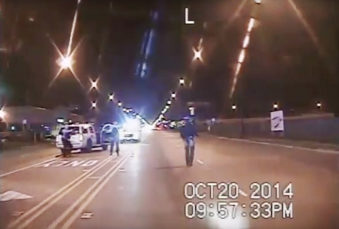 FILE - In this Oct. 20, 2014 frame from dash-cam video provided by the Chicago Police Department, 17-year-old Laquan McDonald, right, walks down the street moments before being shot by white officer Jason Van Dyke in Chicago. The Task Force on Police Accountability recommends abolishing the Independent Police Review Authority, which investigates officer misconduct. The panel was created in the wake of protests over Van Dyke's fatal shooting of McDonald. (Chicago Police Department via AP, File)