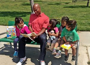 Byron Scott reading to kids (File Photo)