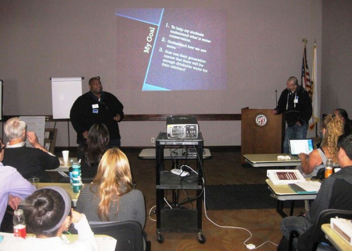 Jerry Dorris (left) and Mario Oropez (right) teachers at Foshay Learning Center in South Los Angeles, share information with other teachers about their stewardship project, the new campus’ Native Plant Garden they developed with their students. Their presentation was on Day 3 of the Environmental Institute held at LADWP headquarter on May 21.