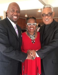 Holman UMC Pastor  Kelvin Sauls, Rev. Judi Wortham-Sauls and Rev. Dr. Frank M. Reid III at a reception for Reid on June 12. (photo by Cora Jackson-Fossett)