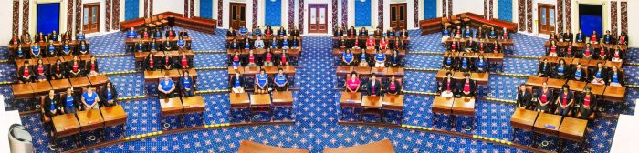 One hundred Black female leaders gather in the Edward M. Kennedy Institutes' replica of the United States Senate chamber to take a symbolic photo for the "Take Your Seat" event. Eric Haynes