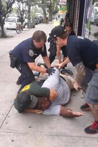 This 2014 photo shows Eric Garner in a choke hold by a police officer moments before he died. AP Photo