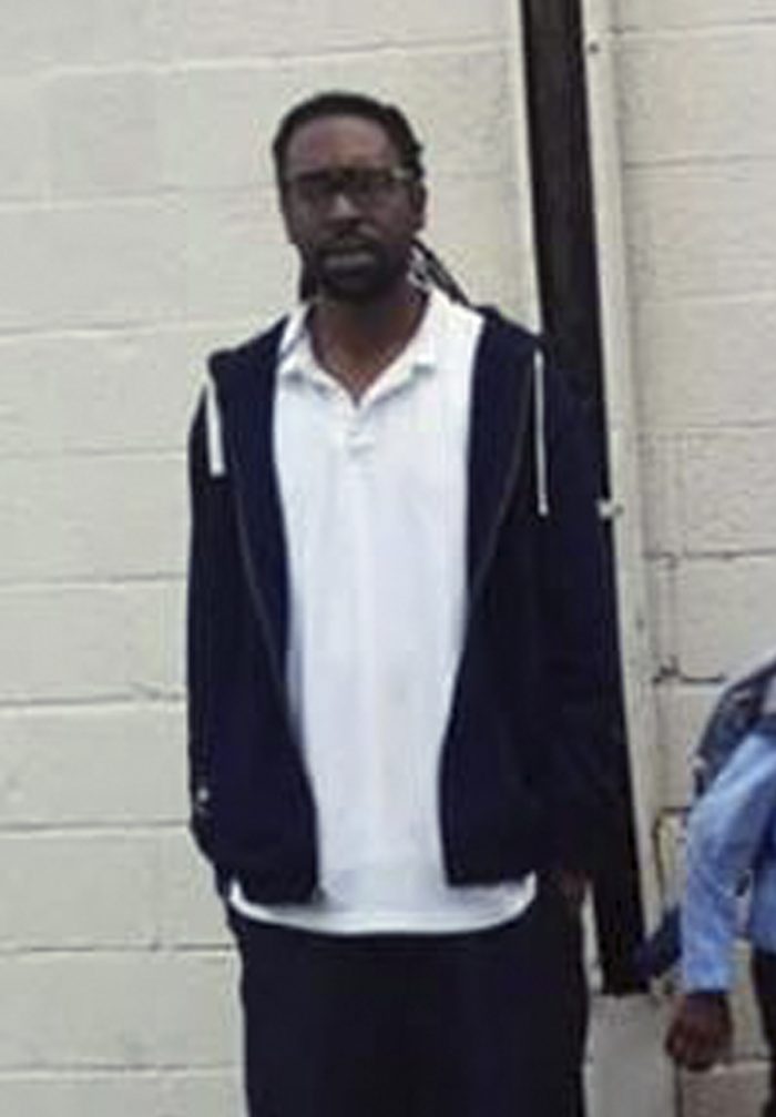 This 2014 photo provided by Dewanda Harris shows Philando Castile of St. Paul, Minn., posing for a photo while attending a family funeral in St. Paul. Officials say Castile was fatally shot by police in Falcon Heights, Minn., Wednesday, July 6, 2016, while inside a car with a woman and a child. (Dewanda Harris via AP)