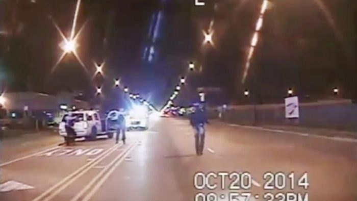 n this image from dash-cam video provided by the Chicago Police Department, Laquan McDonald, right, walks down the street moments before being fatally shot by officer Jason Van Dyke sixteen times in Chicago. (Chicago Police Department via Associated Press) 