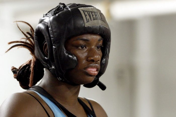 In this Sept. 18, 2012, photo, Olympic gold medal boxer Claressa Shields trains at the Berston Field House in Flint, Mich. Aside from her Olympic title and a jab that could knock someone out cold, Shields isn't much different than other high school seniors. (AP Photo/Carlos Osorio)