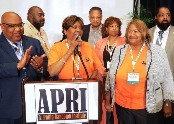 APRI president Clayola Brown (c) and Jesse Jackson ( rear) and Loretta  Johnson (right to Brown) Secretary Treasurer - American Federation of Teachers Union with Congresswoman Brenda Lawrence (D-MI) and , APRI Board members