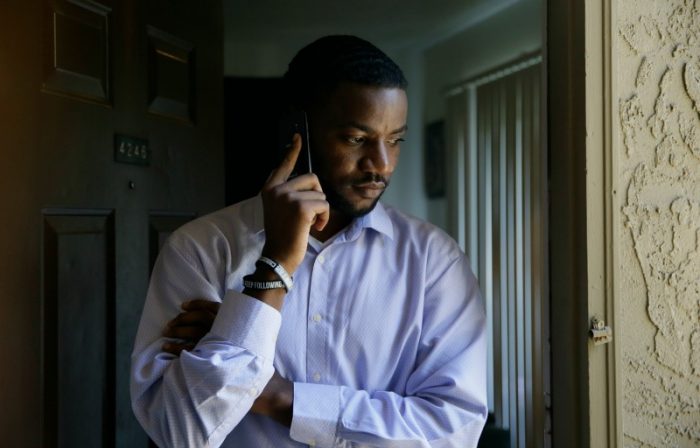 aption2: In this photo made Thursday, Aug. 25, 2016, Dominique Alexander makes cell phone call from the doorway of his apartment in Dallas. Alexander, a leader of the protest where a sniper killed five law enforcement officers in Dallas was ordered to prison Friday, Aug. 26, 2016, for unrelated probation violations. Alexander, the founder of the Next Generation Action Network that organized the July 7 rally to protest fatal police shootings of black men, had been on probation for a 2009 felony conviction for injury to a child.(AP Photo/LM Otero)