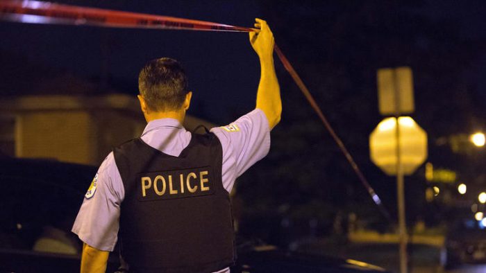 Chicago police investigate after two people were shot in the 1000 block of West 97th Street on Aug 25, 2016, in the Longwood Manor neighborhood. (Erin Hooley / Chicago Tribune)