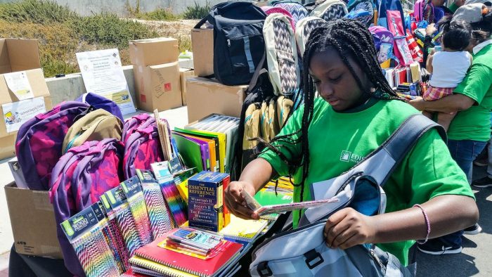  La Tijerra Academy of Excellence Charter School seventh grader Carolyn picks out a new backpack and school supplies donated by SCE's Networkers employee resource group. (Photo by  Melissa Amador) 